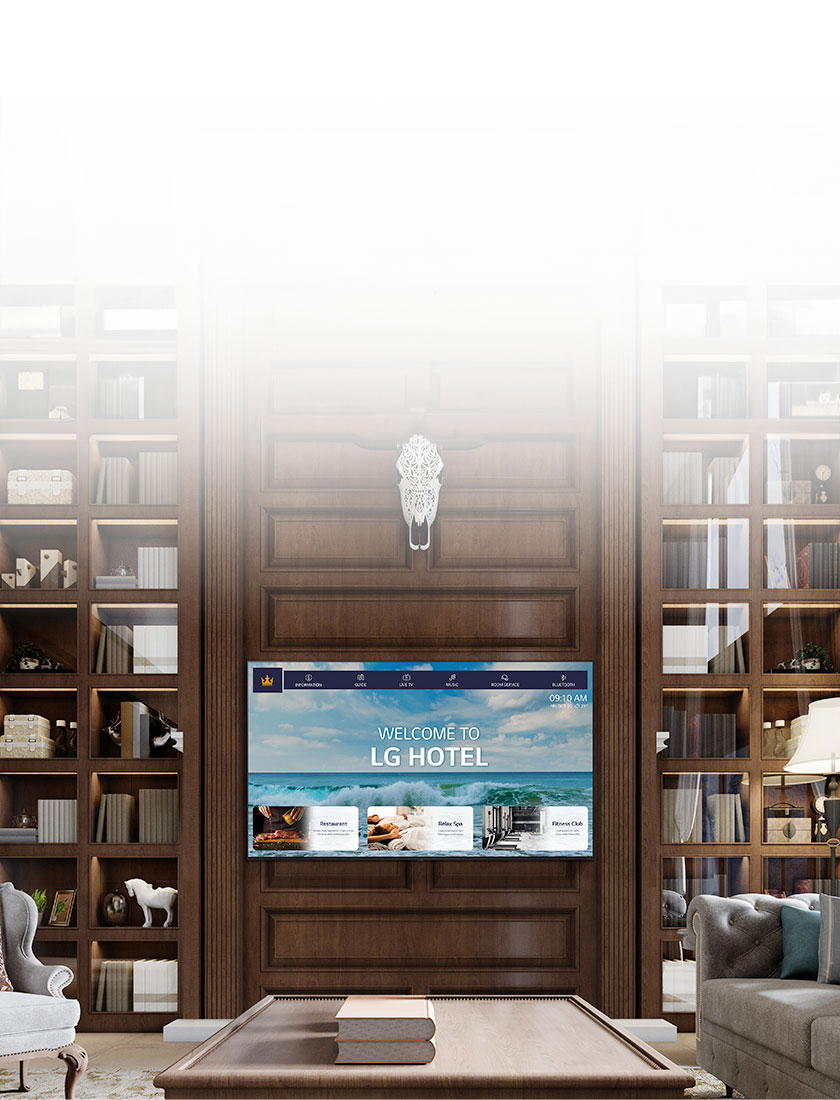 A luxury hotel room features a central TV equipped with LG Pro:Centric, displaying a welcoming message to guests.