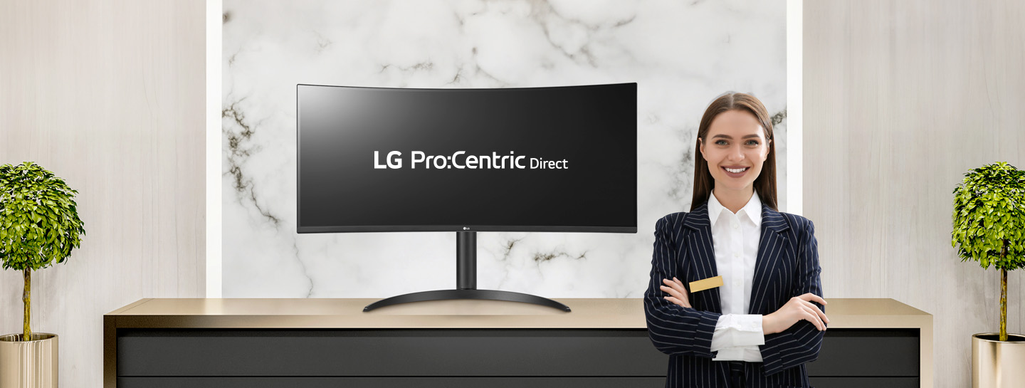 The LG Pro:Centric Direct solution text is visible on the monitor, accompanied by a smiling hotelier.