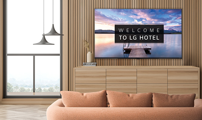 An LG commercial TV is installed in a hotel room.